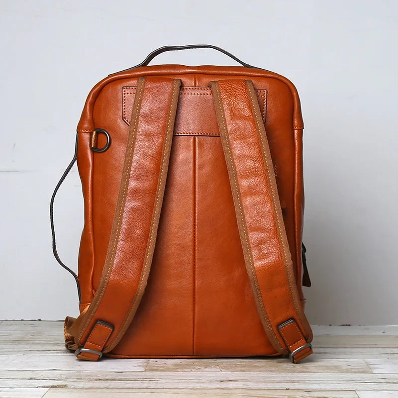 Brown leather backpack with an elegant design, with comfortable straps and high quality finish - back view.