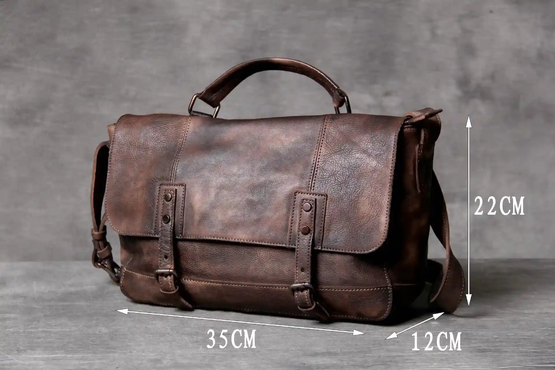 Brown leather bag measuring 35cm wide, 22cm high and 12cm deep, front view.