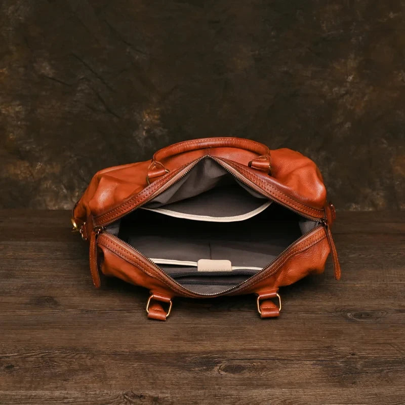 Interior view of a brown leather handbag showcasing its spacious compartments.