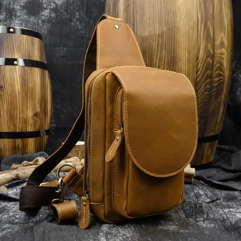 Brown leather bag, ideal for daily use and casual style, featuring a modern and practical design, front view.