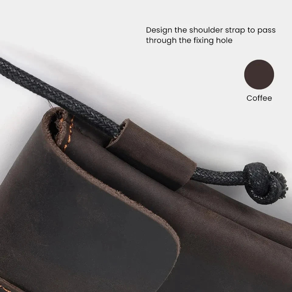 Detailed image of a coffee brown leather bag with a shoulder strap designed to pass through the fastening hole. 