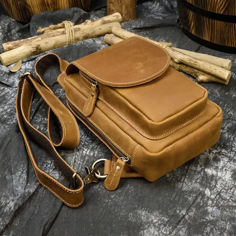 Brown leather men's bag with an elegant and practical design and front pocket.