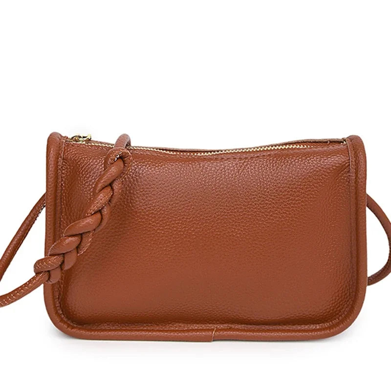Stylish brown leather crossbody bag with braided strap - front view