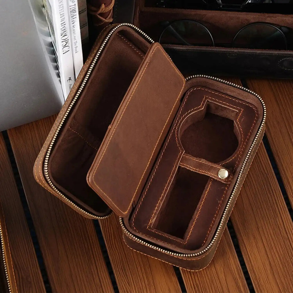 interior of a brown leather watch case with zipper closure, ideal for storing watches and accessories.