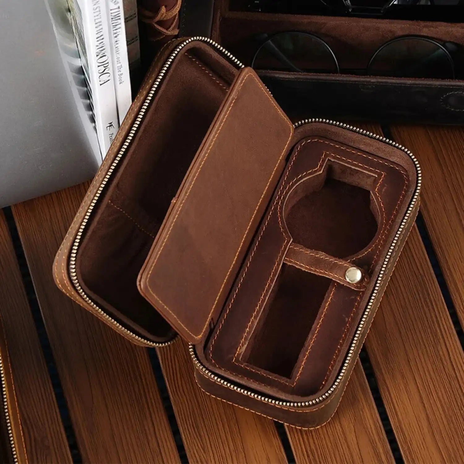 interior of a brown leather watch case with zipper closure, ideal for storing watches and accessories.