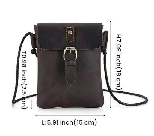 Brown leather crossbody bag with long strap - front view.
