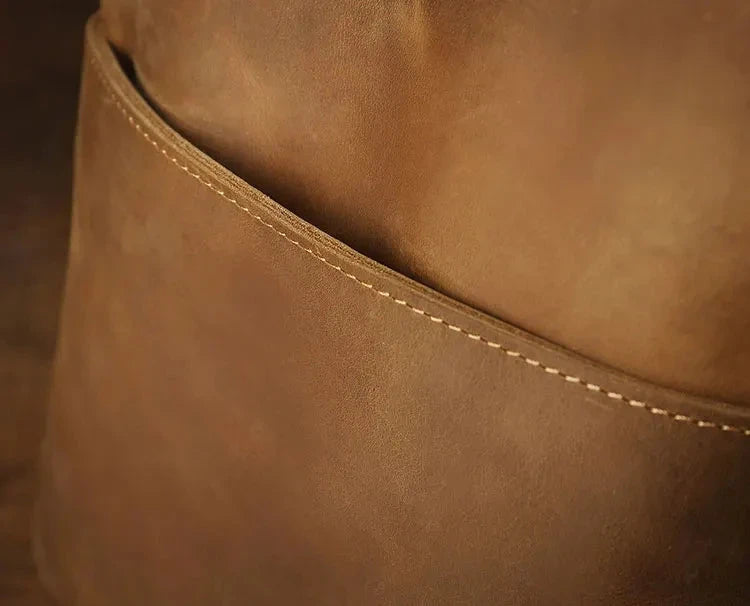 close-up of a brown leather texture highlighting the texture, fine stitching and finishing details.