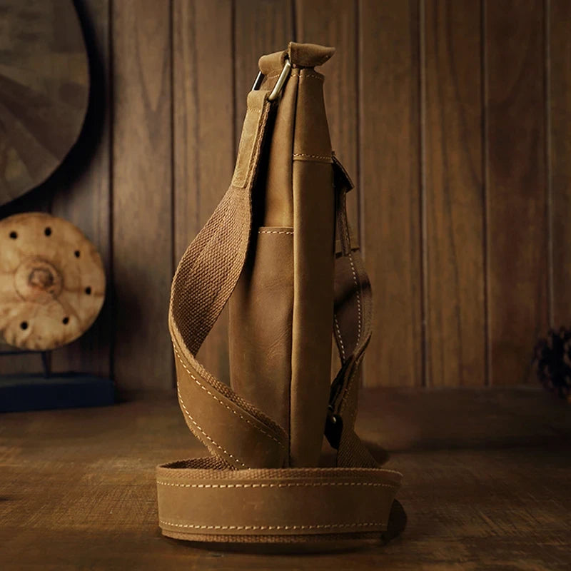 Brown leather crossbody bag, with adjustable strap, stylish design and ample space for essentials - side view.