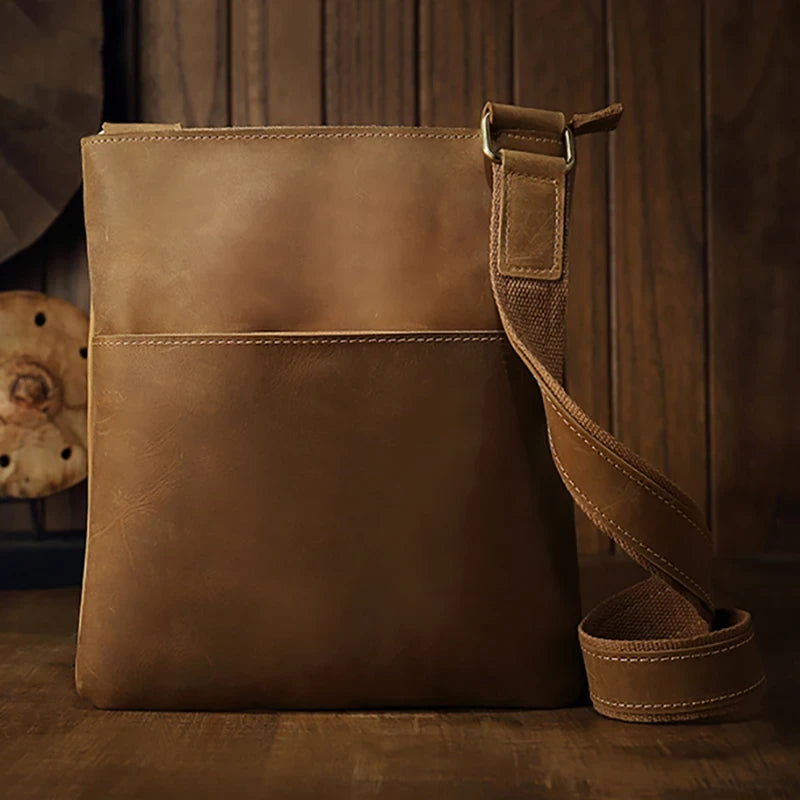 Brown leather crossbody bag, with adjustable strap, stylish design and ample space for essentials - front view.
