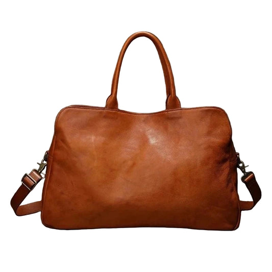 Brown leather duffle bag with a shoulder strap on a white background, front view.
