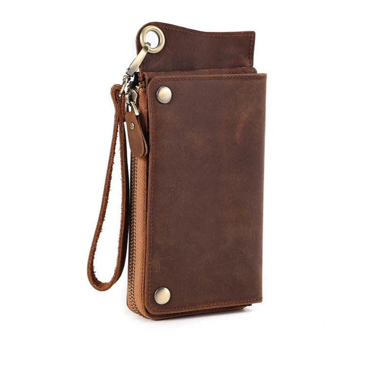Brown leather wallet with zipper, with an elegant leather wrist strap - front view.