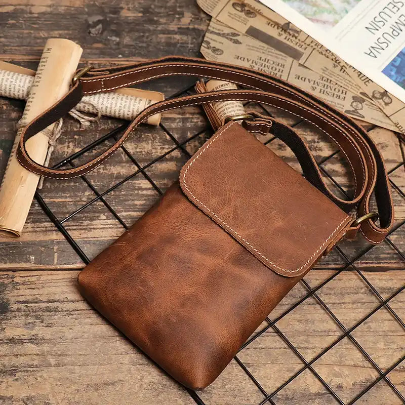 Vintage brown leather mini shoulder bag with adjustable strap - top view