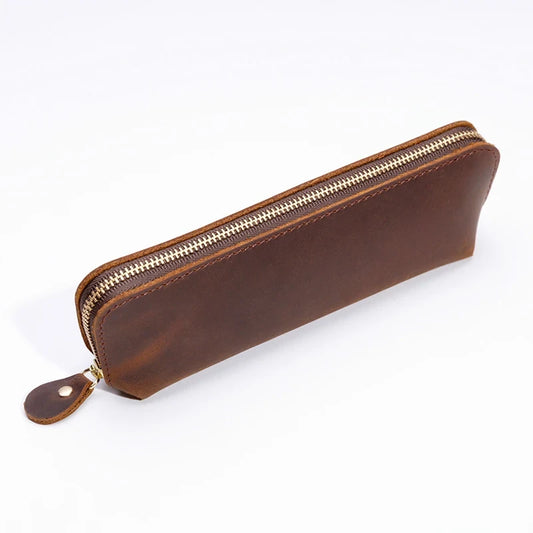 A durable brown leather pen case featuring a smooth zipper, front view.