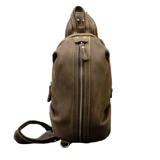 Stylish brown leather shoulder bag on a white background, front view