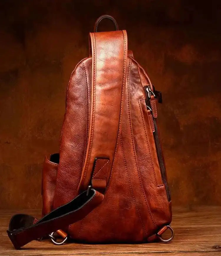 back view of a stylish leather shoulder bag in rich brown color.