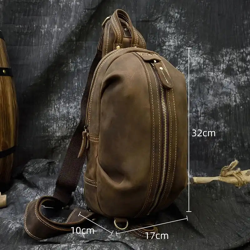 Brown leather shoulder bag measuring 32cm high, 17cm wide and 10cm deep, front view.