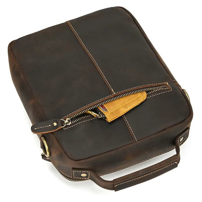 Stylish vintage brown leather laptop bag with a zipper and handle
