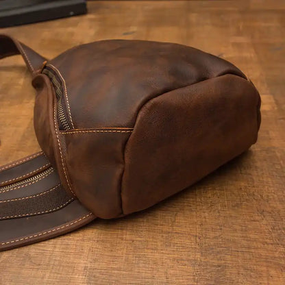 Detailed view of a stylish brown leather bag showcasing its texture and stitching.