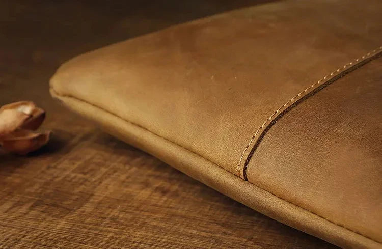 close-up of a brown leather texture highlighting the texture and fine stitching 