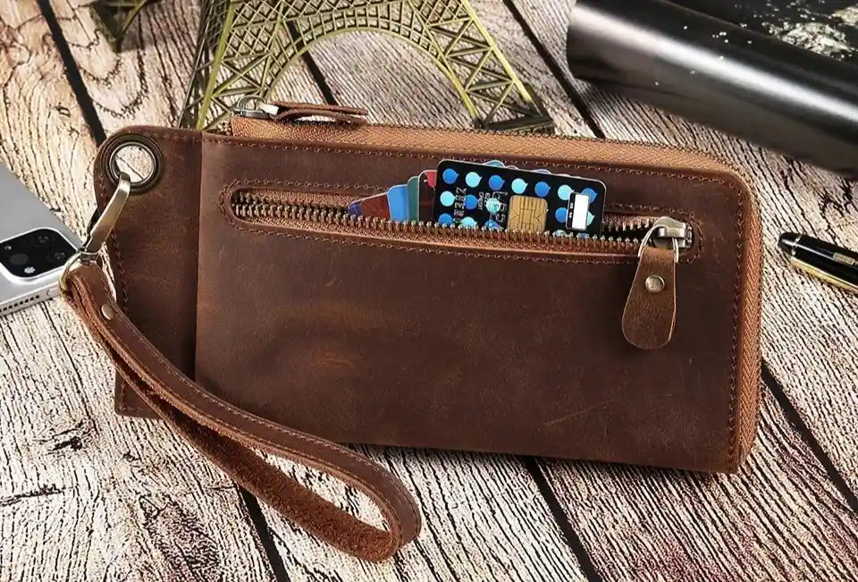 Brown leather wallet with card slots and zipper, ideal for daily use and security - front view.