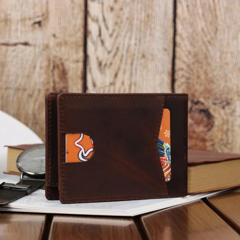 Stylish brown leather wallet displaying cards on a wooden table.