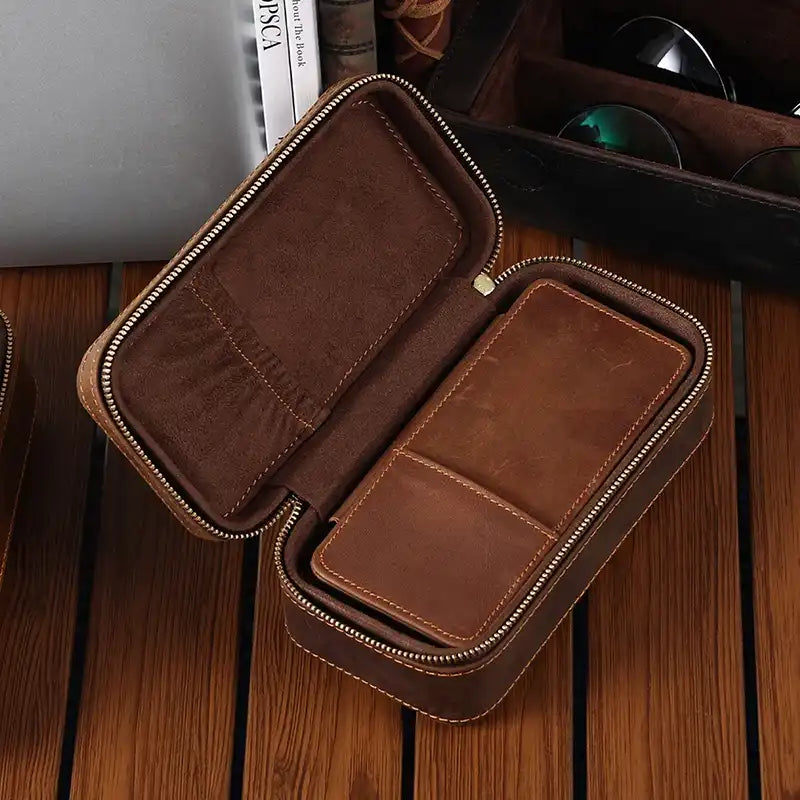open brown leather case with zipper, ideal for storing watches, cards, and small objects in an organized and safe way.