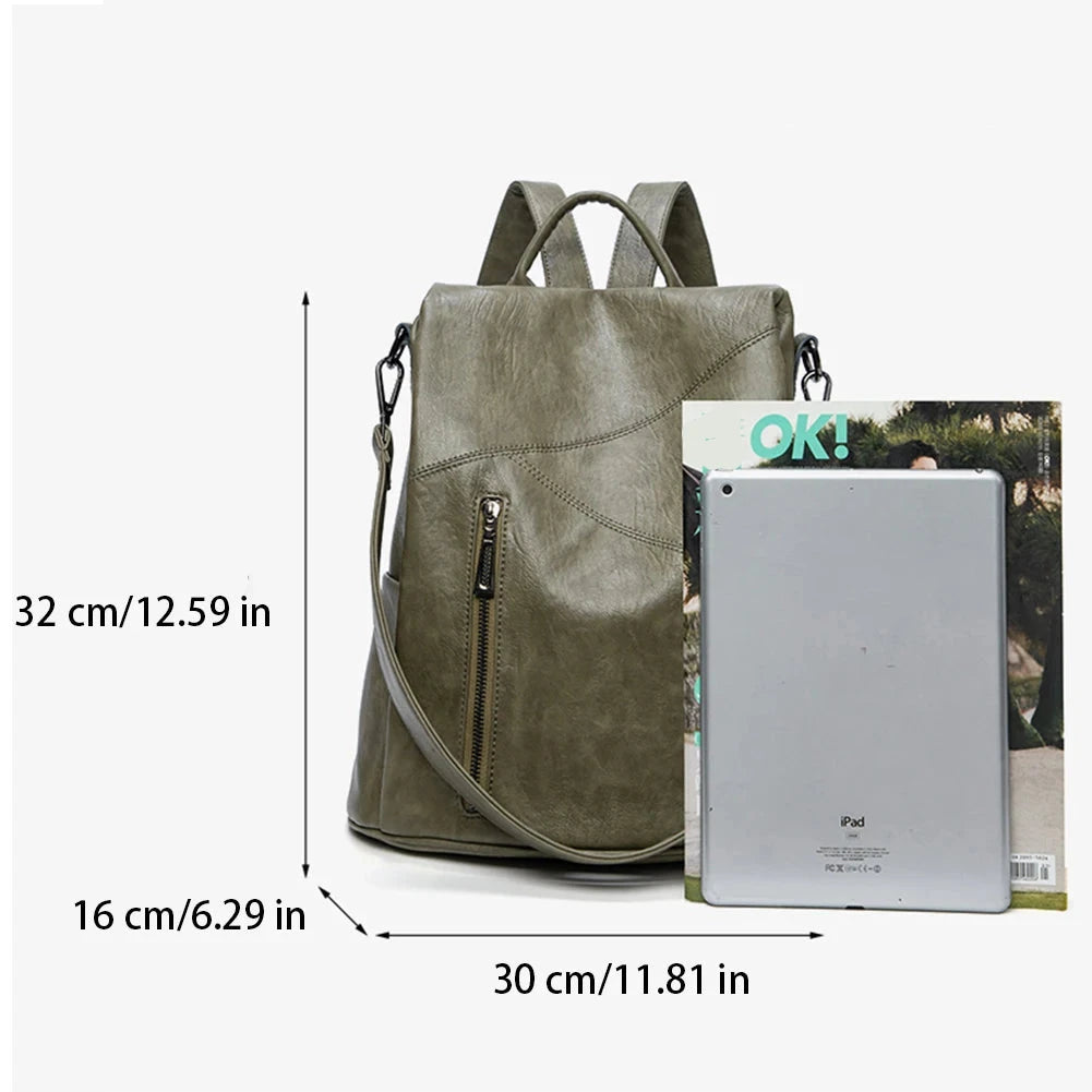 A stylish green backpack with dimensions displayed alongside a magazine and tablet for size comparison.