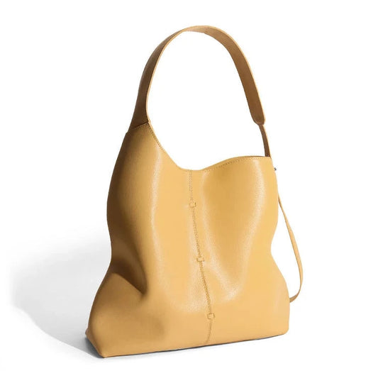 Elegant yellow leather bag with a modern design and adjustable strap- variant.