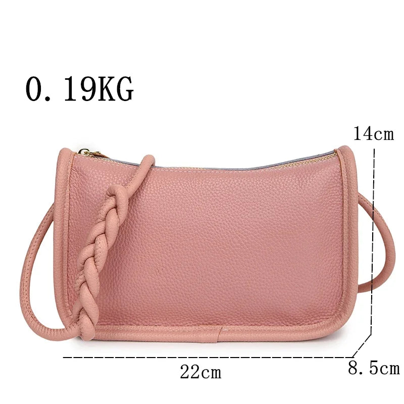 Stylish pink handbag with braided strap and zipper closure - front view with dimensions.