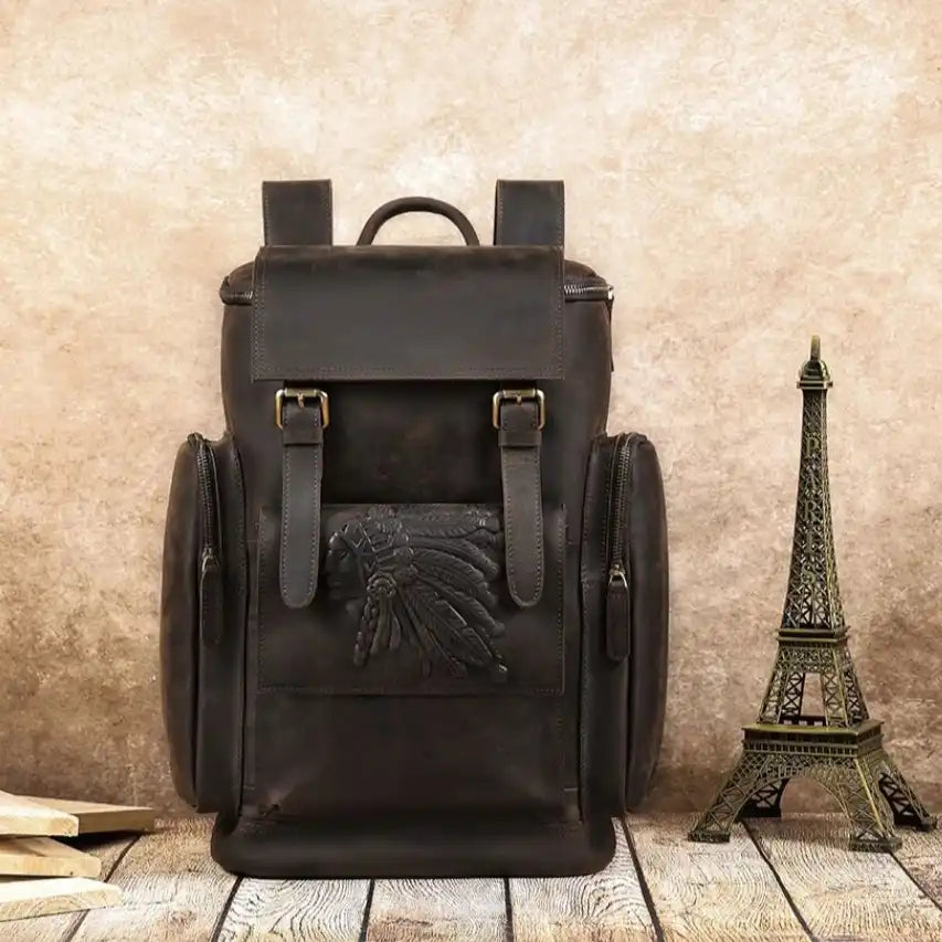 coffee brown leather backpack with an elegant embossed design, and external pockets - front view.