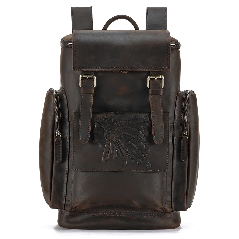 A vintage brown leather backpack with embossed design and multiple pockets - front view.