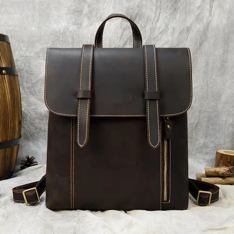 Coffee brown leather backpack with an elegant and functional design, with front zipper, classic style and durability.