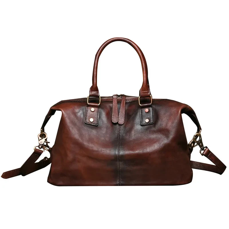 Vintage style coffee brown leather bag with handles and large compartment, front view. 