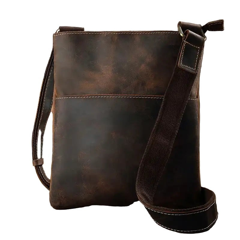 Brown leather crossbody bag on a white background, front view.