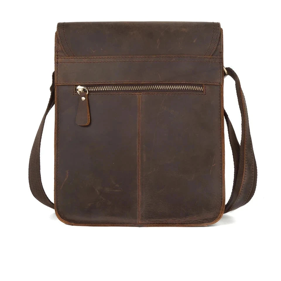 Coffee brown leather crossbody bag with elegant design, zipper closure and shoulder strap, back view.