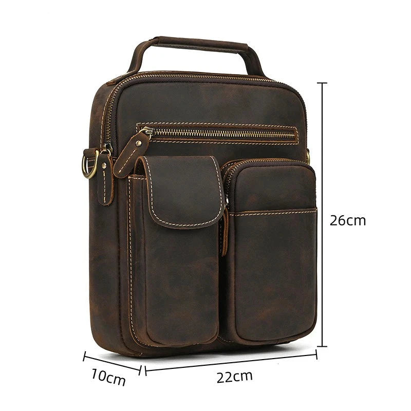 Brown leather shoulder bag measuring 26cm high, 22cm wide and 10cm deep, ideal for carrying a laptop and accessories.