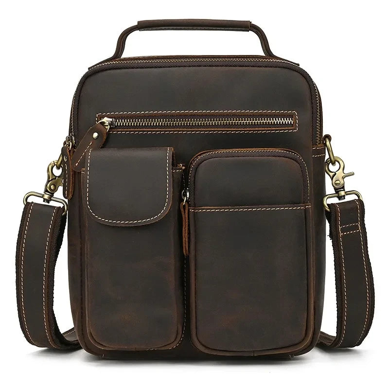 coffee brown leather suitcase with multiple compartments and adjustable strap, ideal for a laptop or daily use - front view.