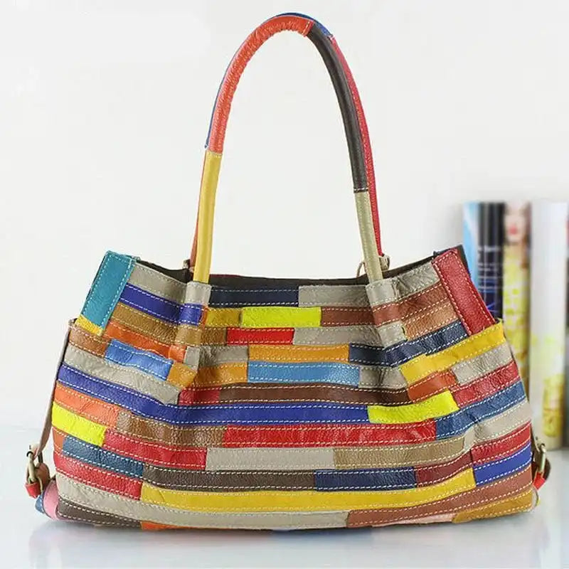 A vibrant and stylish colorful leather tote bag featuring a unique striped design, front view.