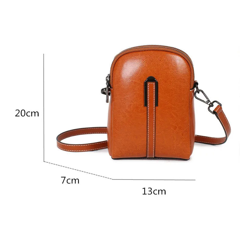 Stylish caramel color leather crossbody bag with dimensions 20cm x 13cm x 7cm - front view