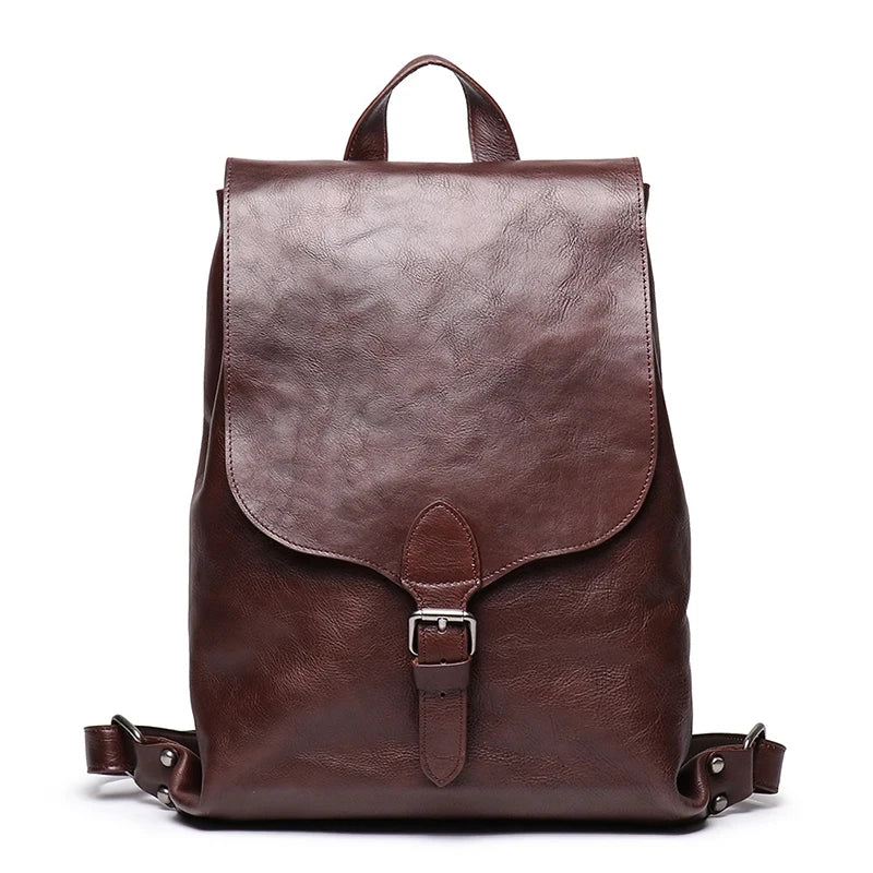 dark brown leather backpack with classic design, with sot handle and elegant buckle - front view.
