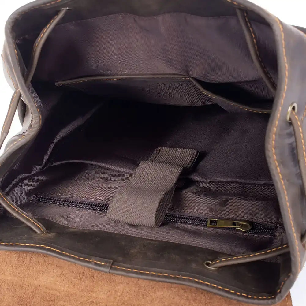 interior view of a leather bag, showing compartments and a zipper, ideal for organizing your essentials with style and functionality.