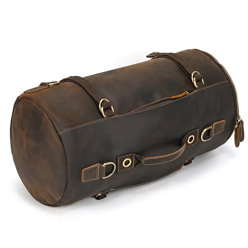 Dark brown leather duffle bag with  light stitching details and practical handles, front view.