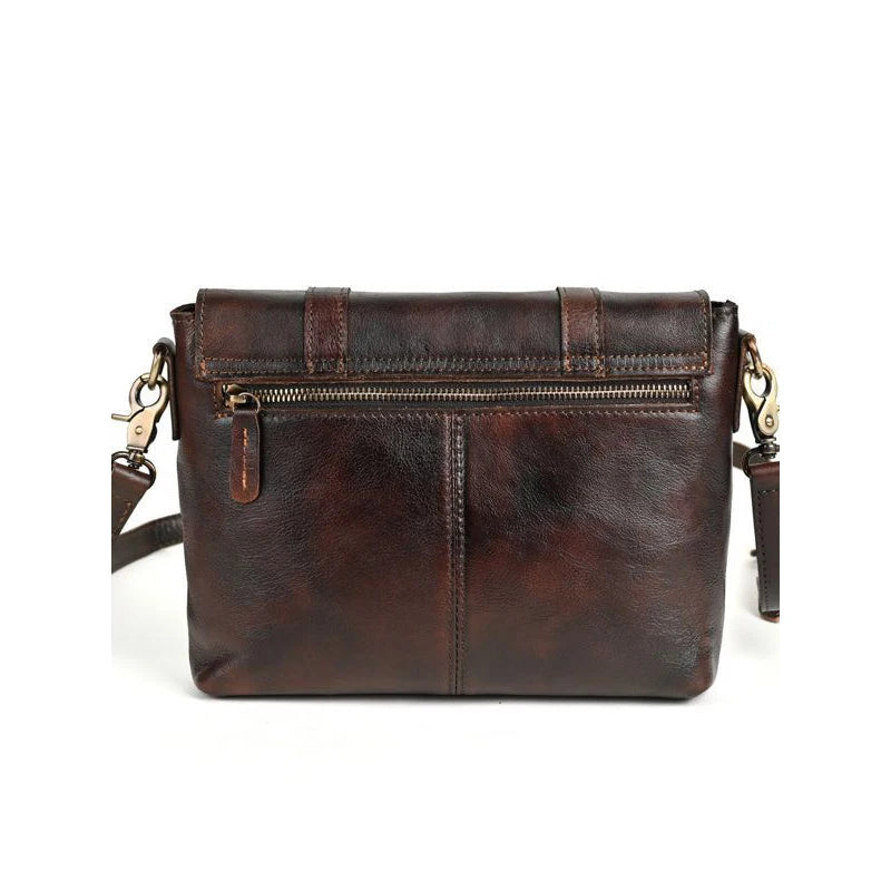 Elegant dark brown leather shoulder bag with adjustable strap and zipper - back view.
