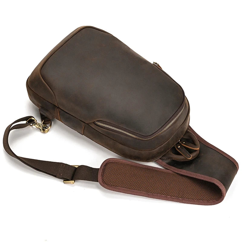 dark brown leather shoulder bag with an elegant design, with adjustable strap and spacious storage compartments.