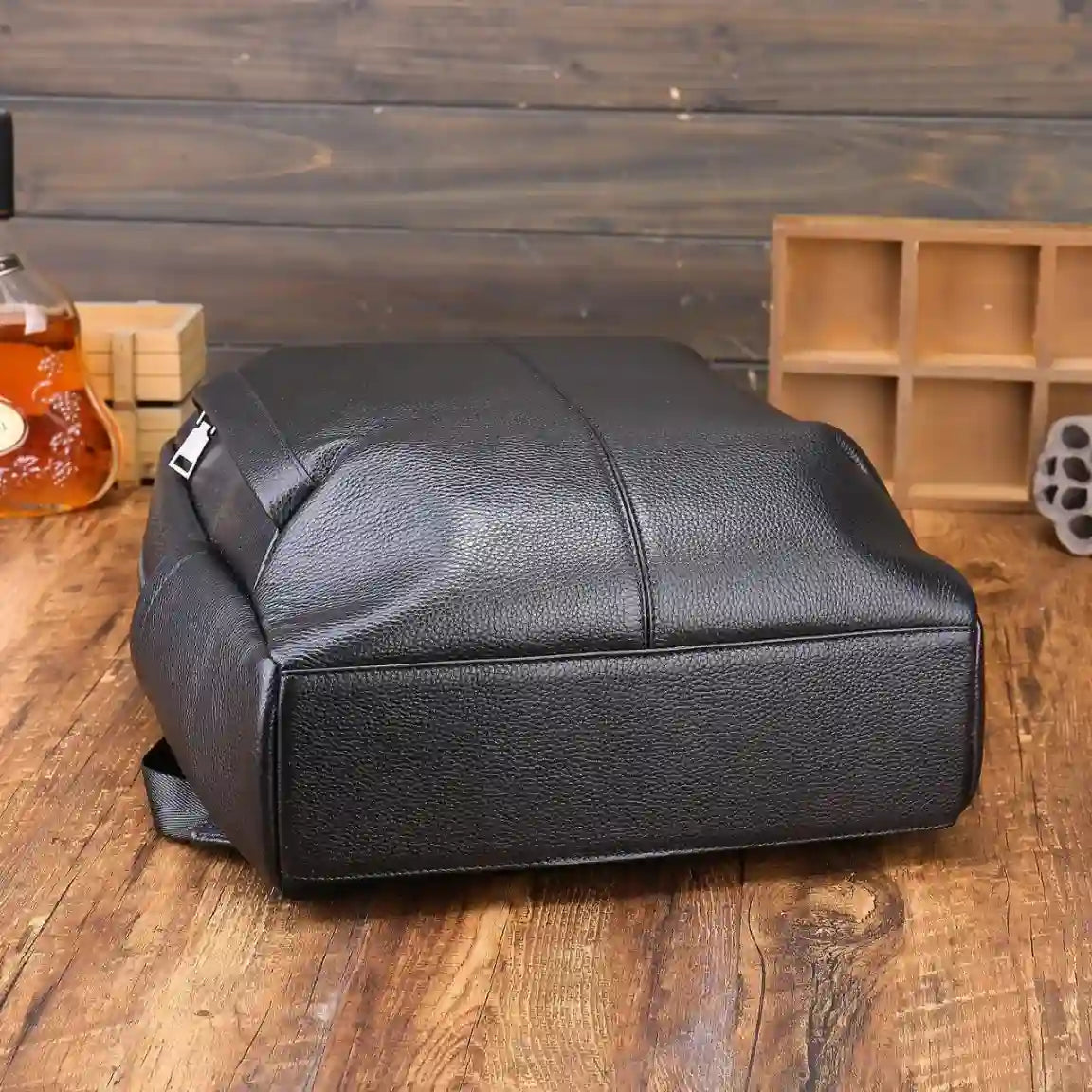 Sleek black leather bag showcasing its texture and design.