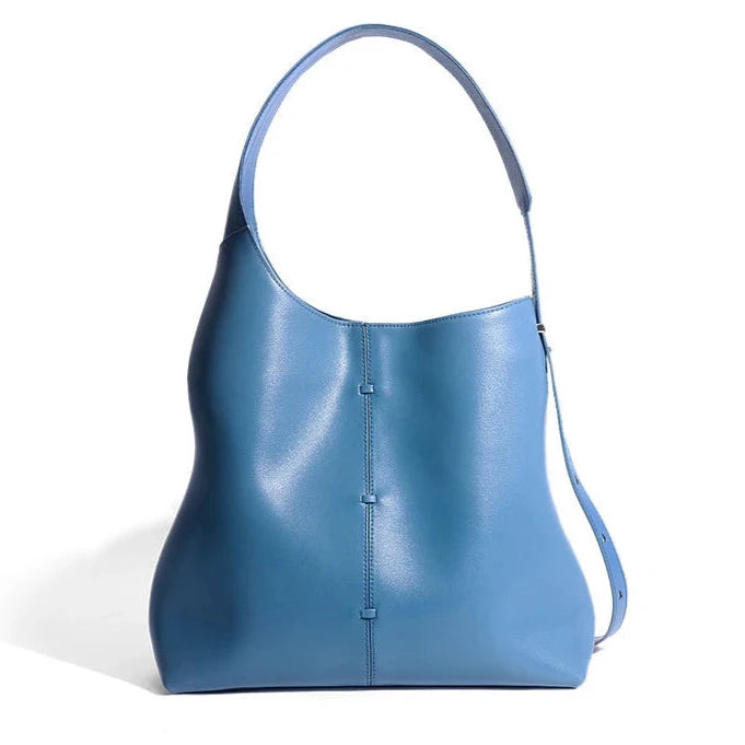 Elegant bue leather bag with a modern design and adjustable strap- variant.