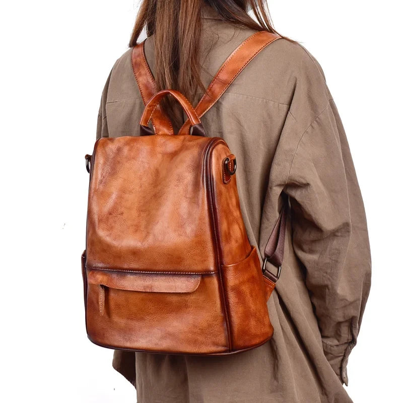 Stylish vintage leather backpack worn woman's back.