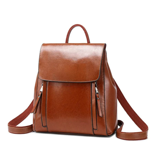 Stylish brown leather backpack with zipper pockets, adjustable straps and soft handle - front view