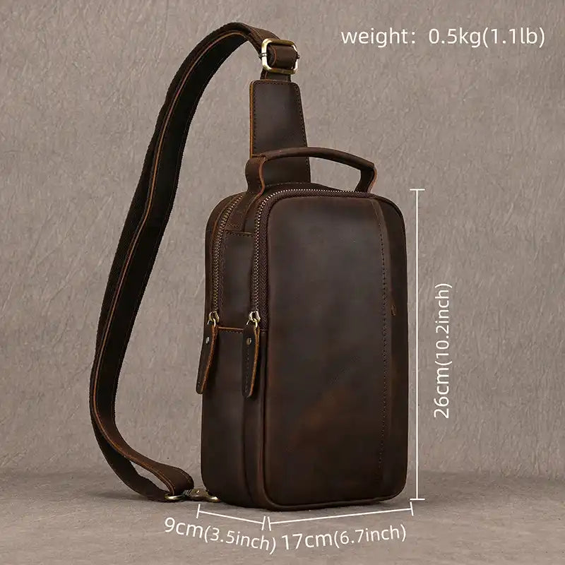 Dark brown leather crossbody bag with adjustable strap measuring 26cm high x 17cm wide  x 9cm deep.