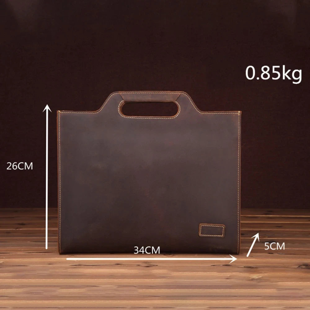 Elegant and compact leather briefcase, sophisticated design, measures 34CM by 26CM, front view.